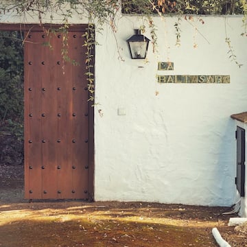 a door and a light on a wall