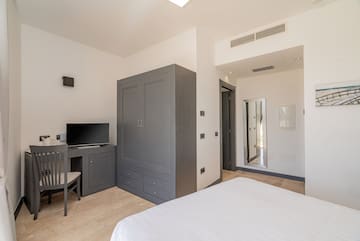 a room with a bed and a desk