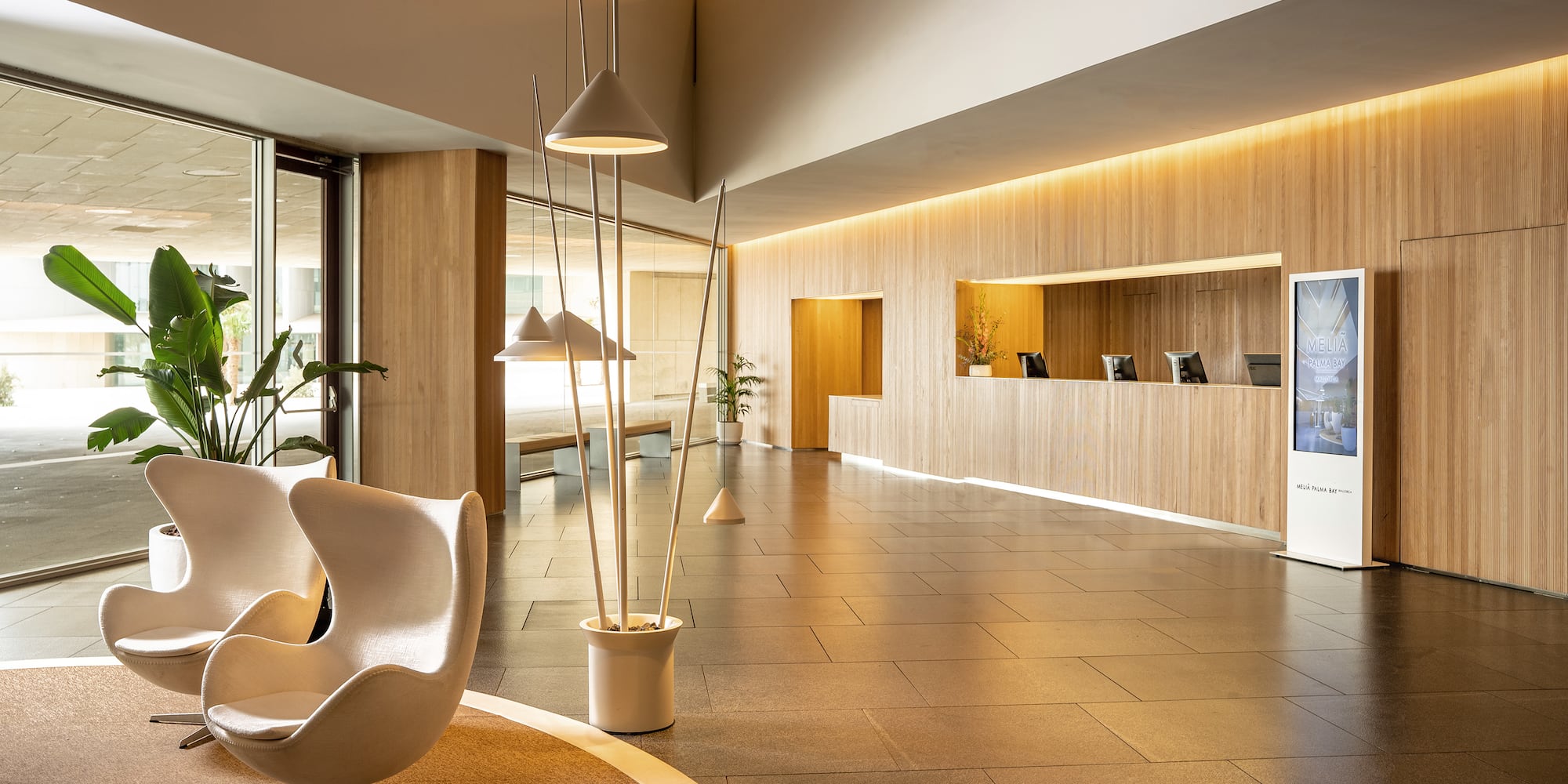 a lobby with a large window and a television