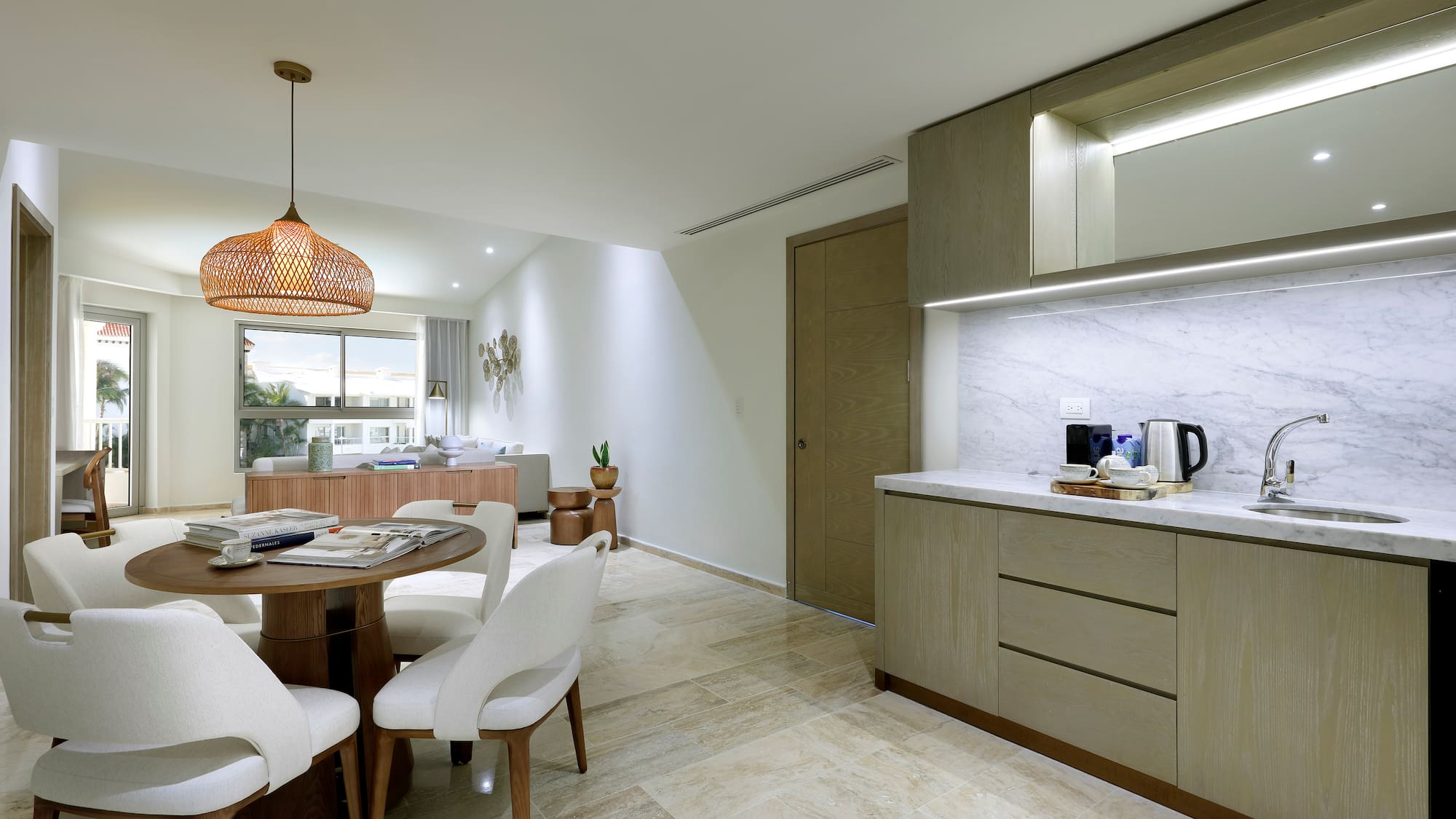 a kitchen and dining room with a table and chairs