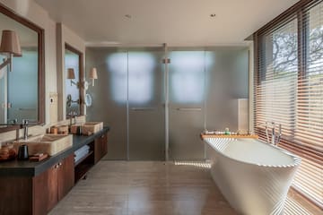 a bathroom with a tub and sink