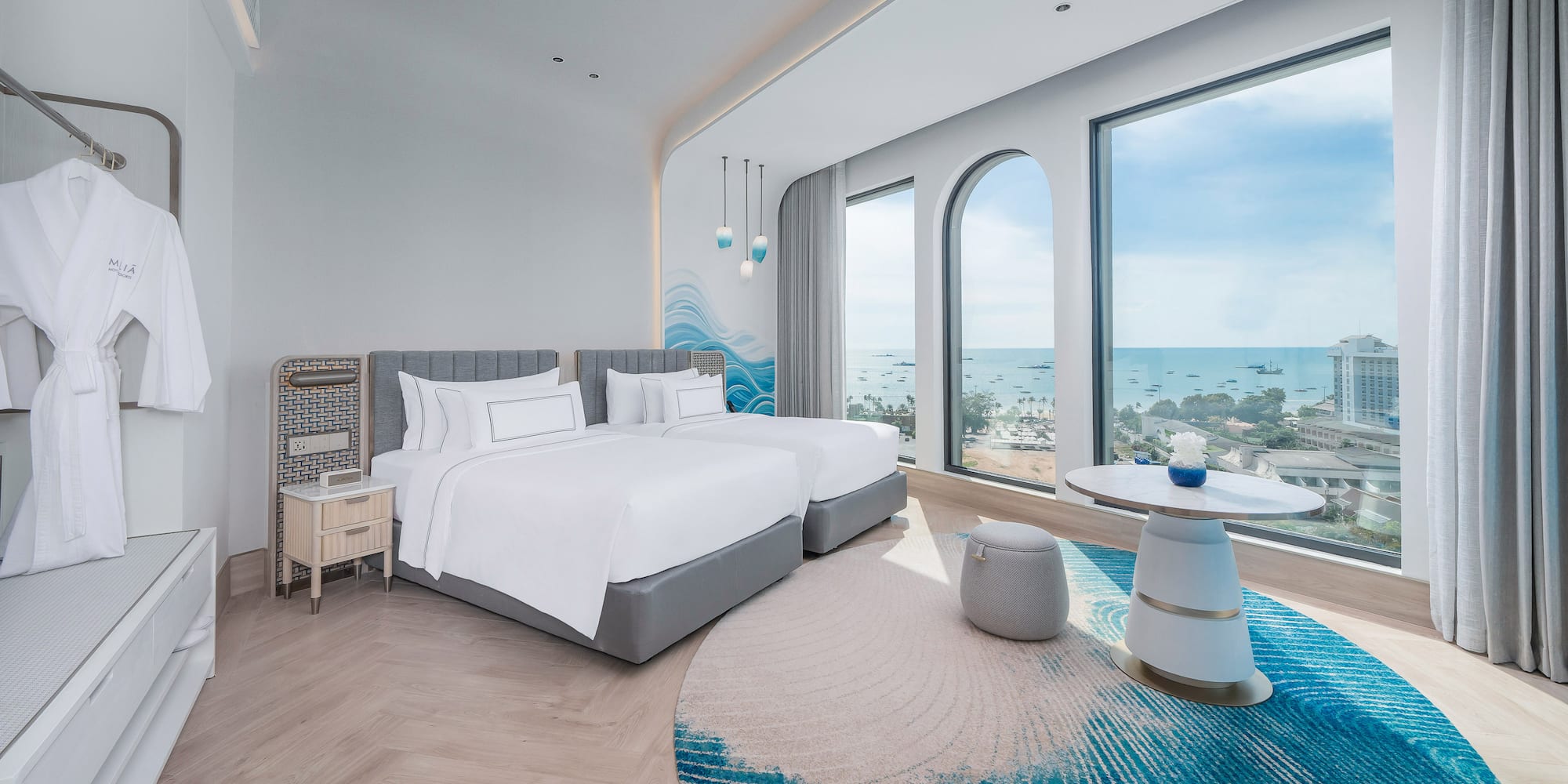 a room with a bed and a table and a round table