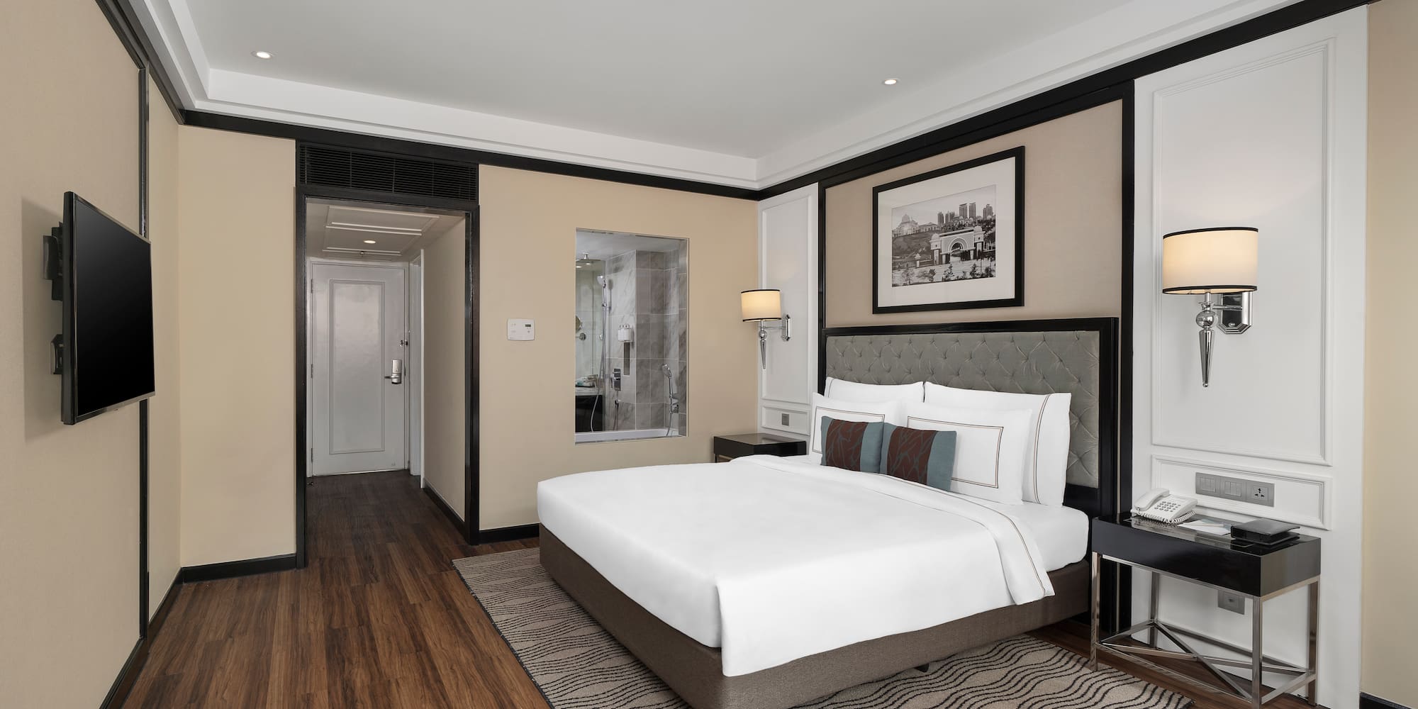 a bedroom with a bed and a wood floor