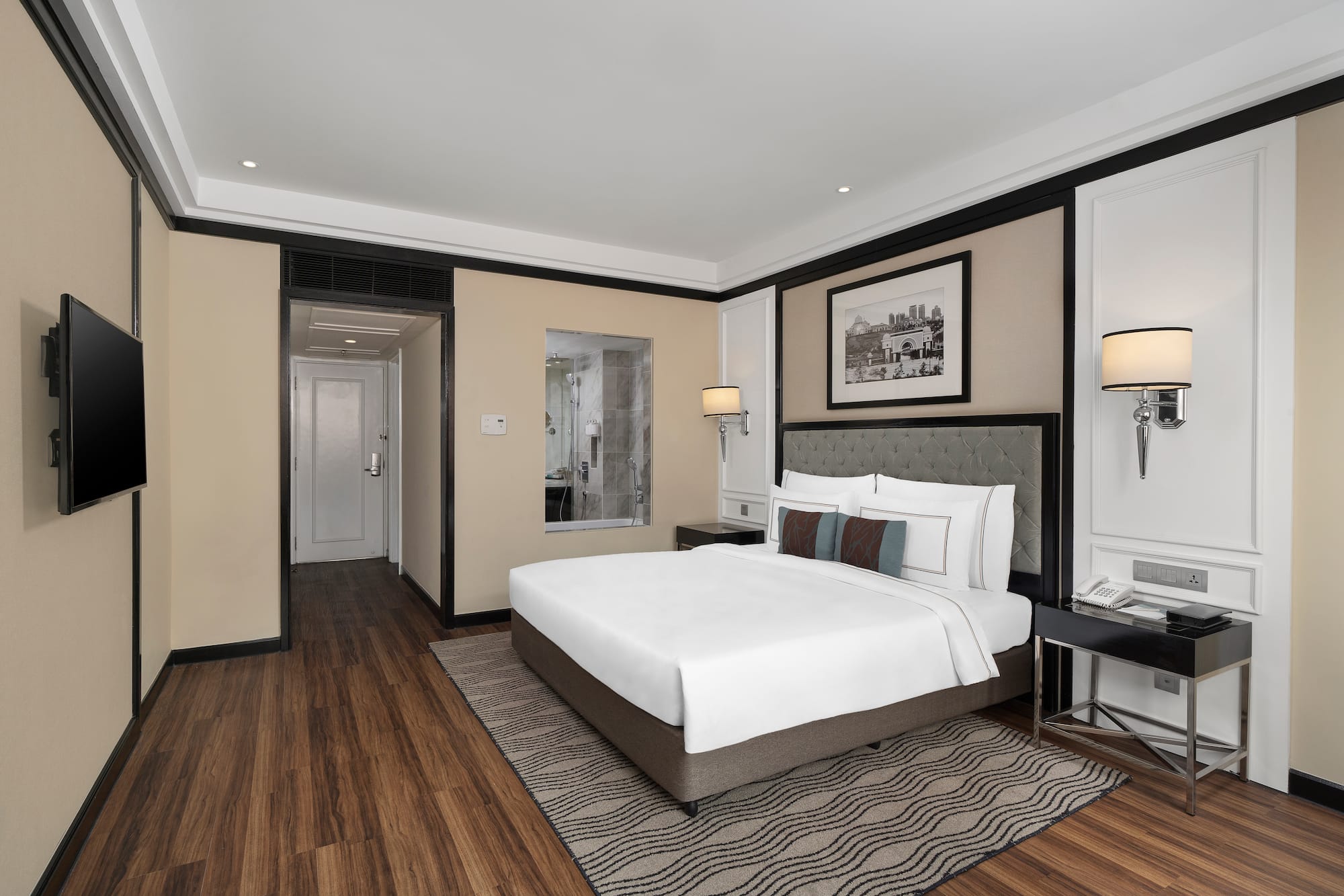 a bedroom with a bed and a wood floor