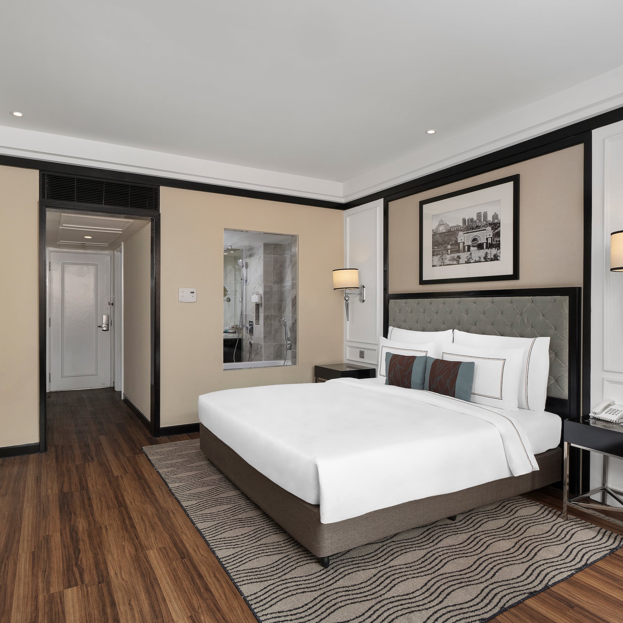 a bedroom with a bed and a wood floor