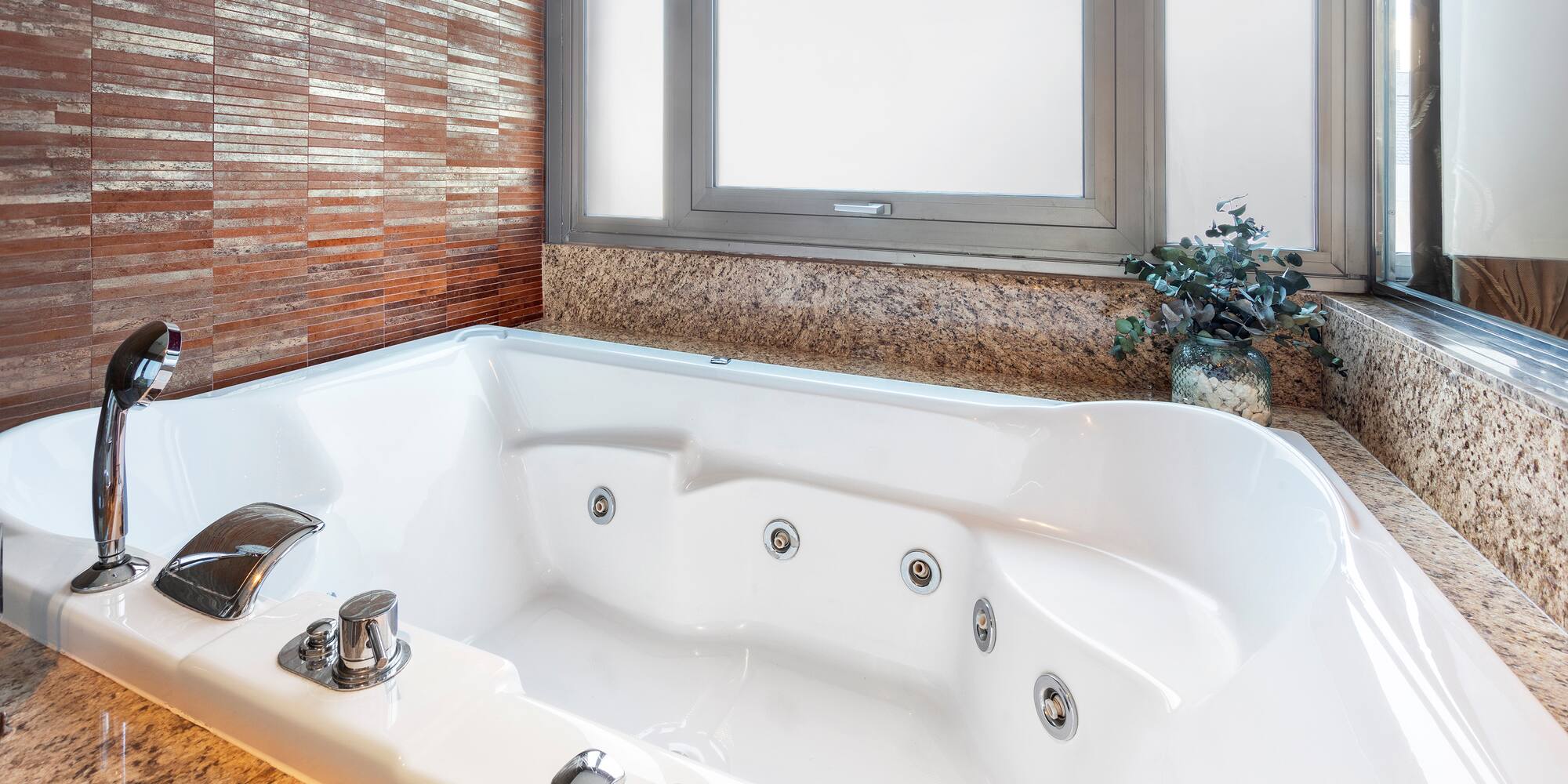 a white bathtub in a bathroom