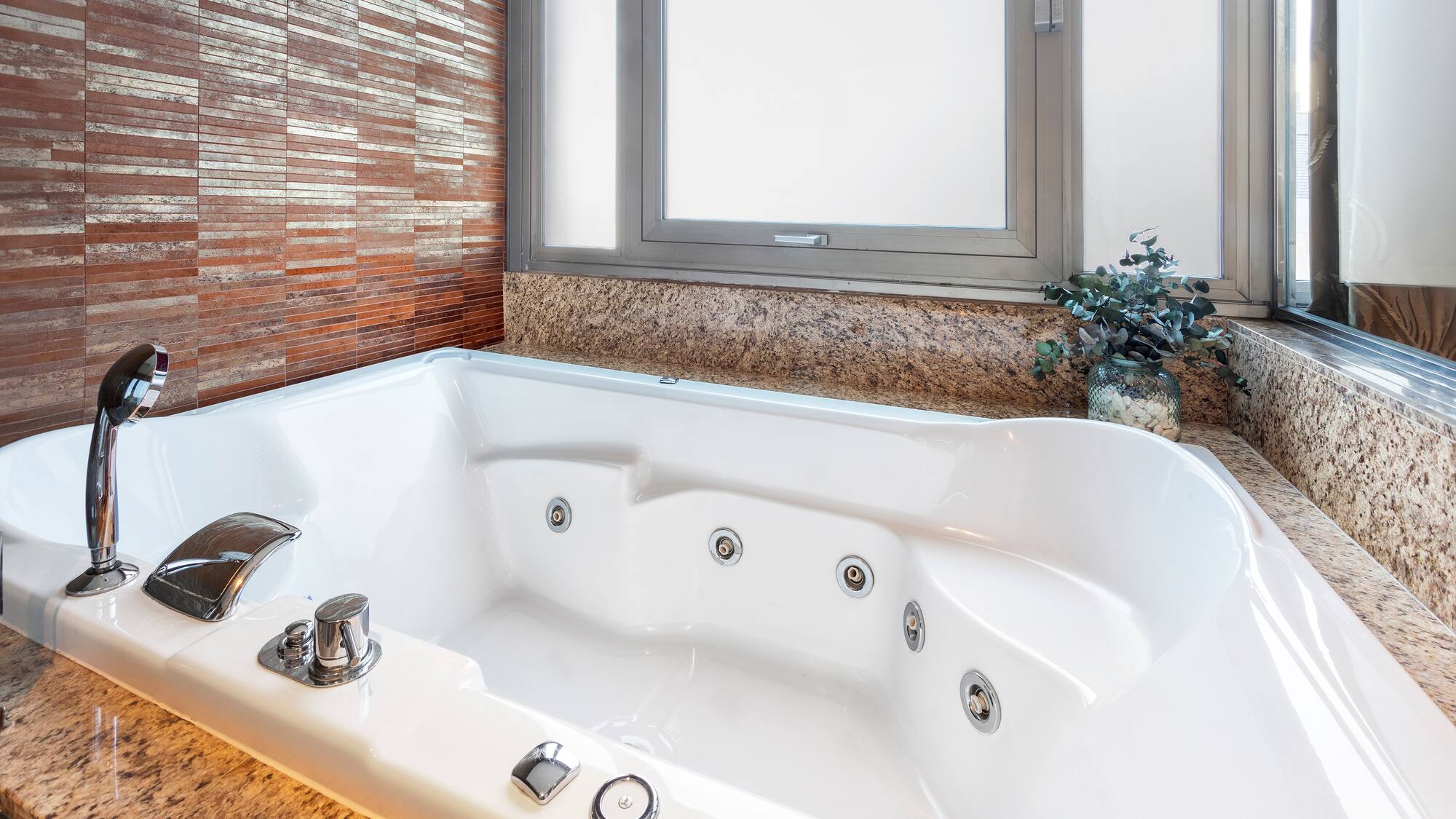 a white bathtub in a bathroom