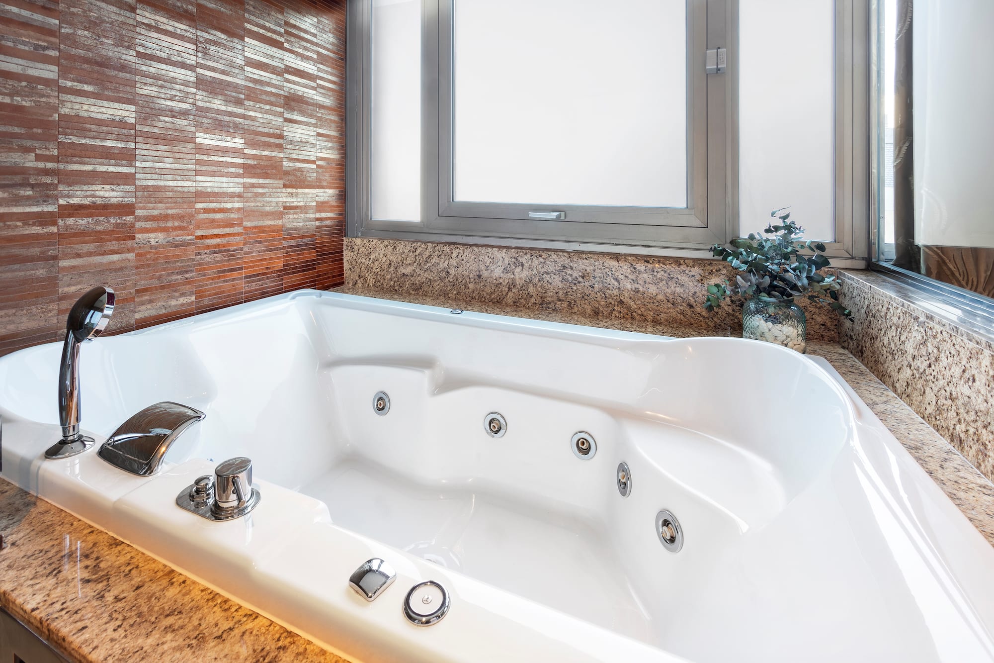 a white bathtub in a bathroom