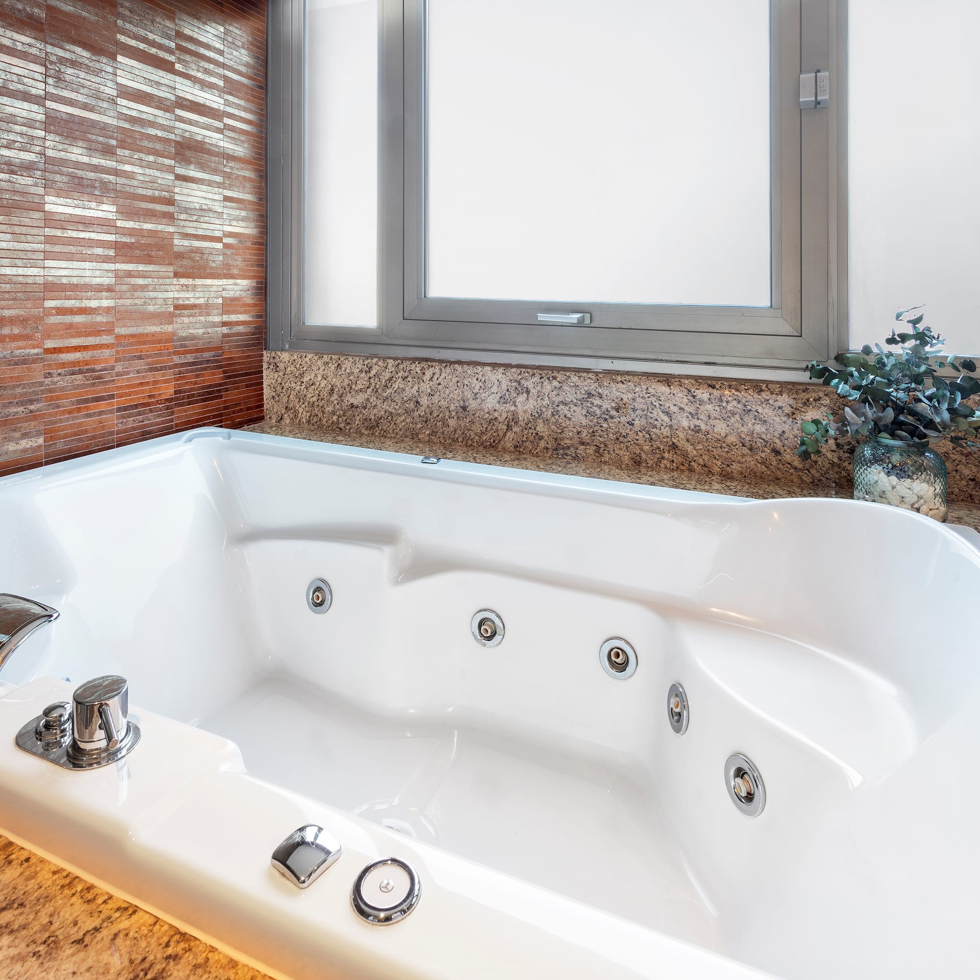 a white bathtub in a bathroom