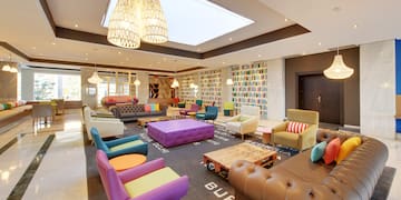 a room with colorful furniture and a large ceiling