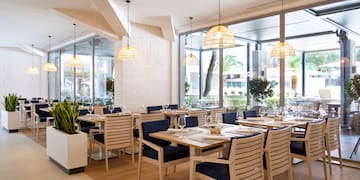 a restaurant with tables and chairs