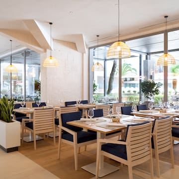 a restaurant with tables and chairs