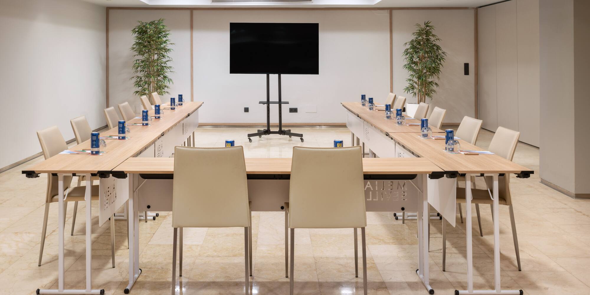 a room with a large table and chairs