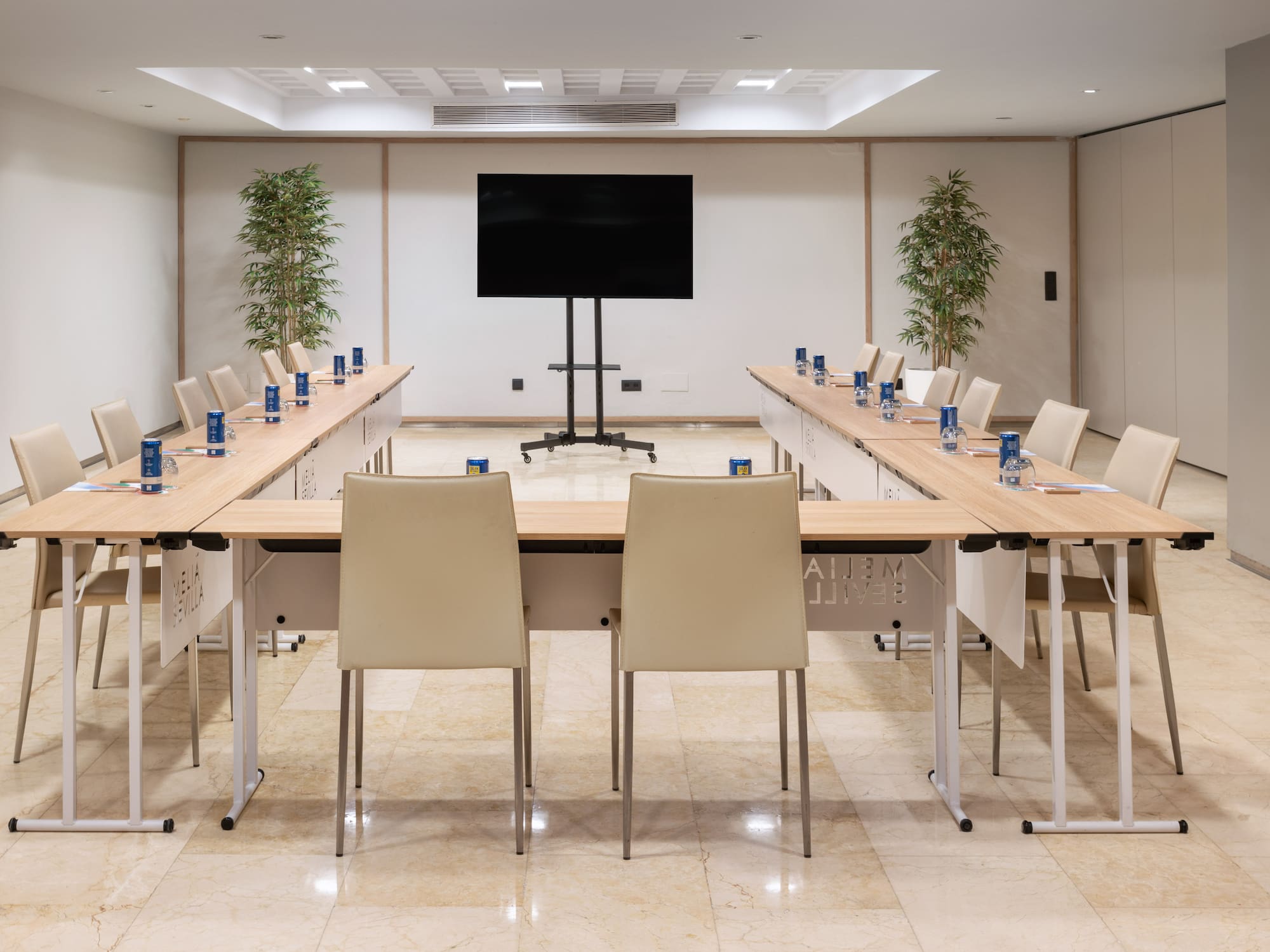 a room with a large table and chairs