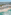Cancun luxury beach resort aerial: pyramid hotels, pools, turquoise ocean.