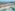 Cancun luxury resort on white sand beach, pyramid hotels, turquoise ocean.