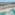 Cancun luxury resort: pyramid buildings, white beach, turquoise ocean, pools.