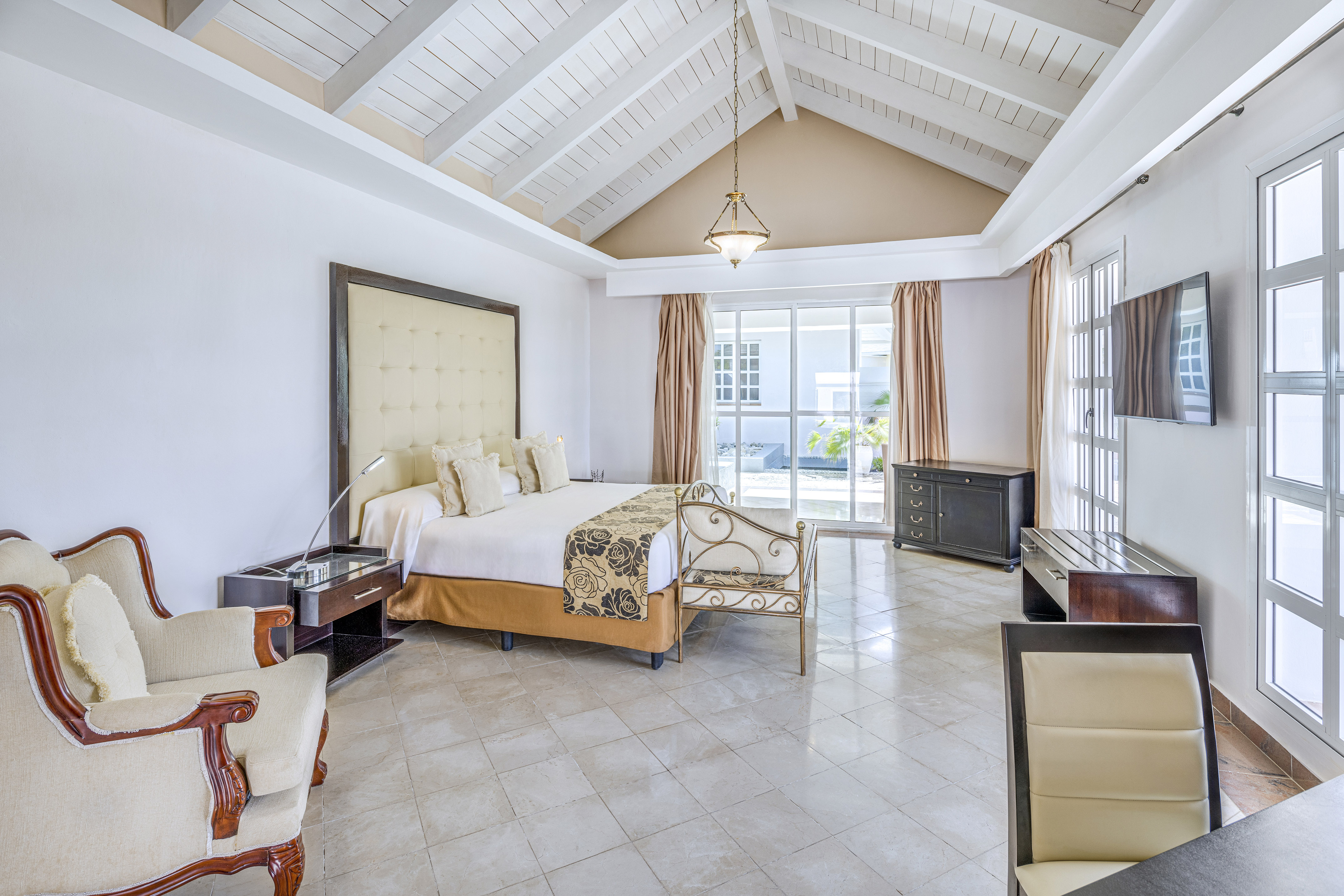 a bedroom with a bed and a piano