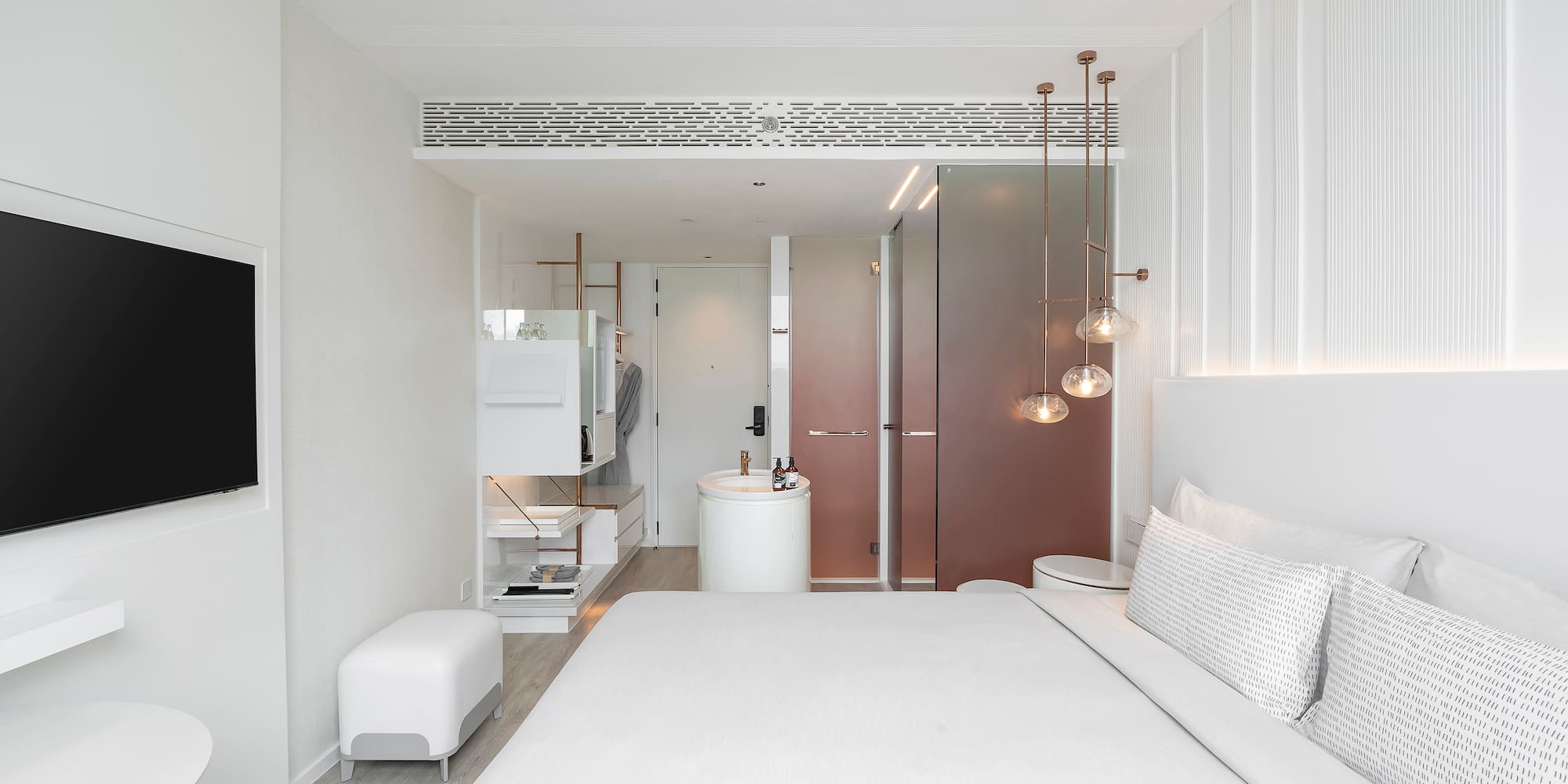 a bedroom with a sink and a bed