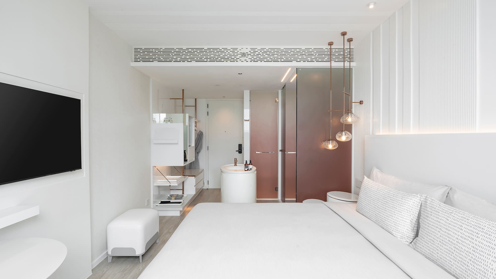 a bedroom with a sink and a bed