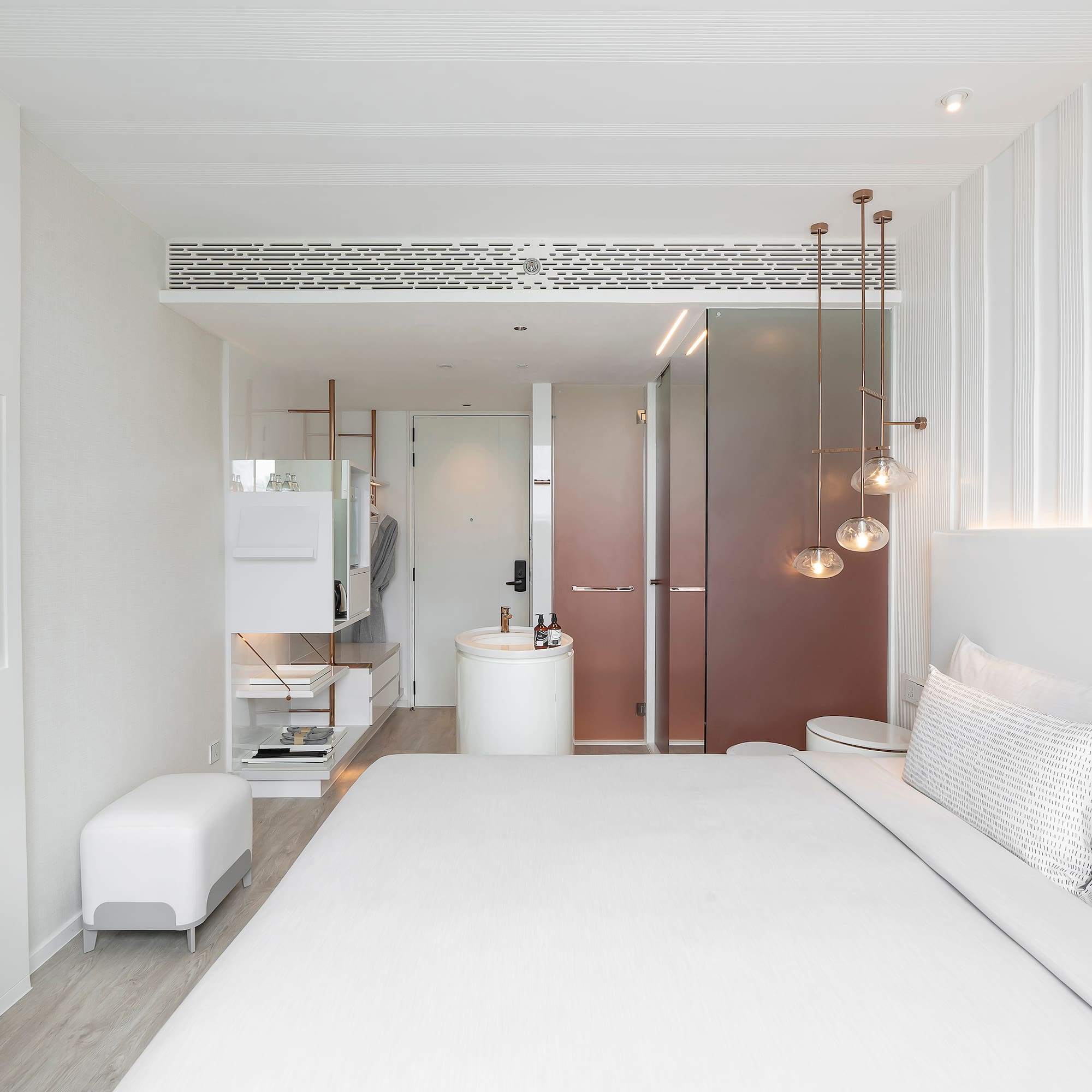 a bedroom with a sink and a bed