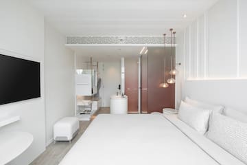 a bedroom with a sink and a bed