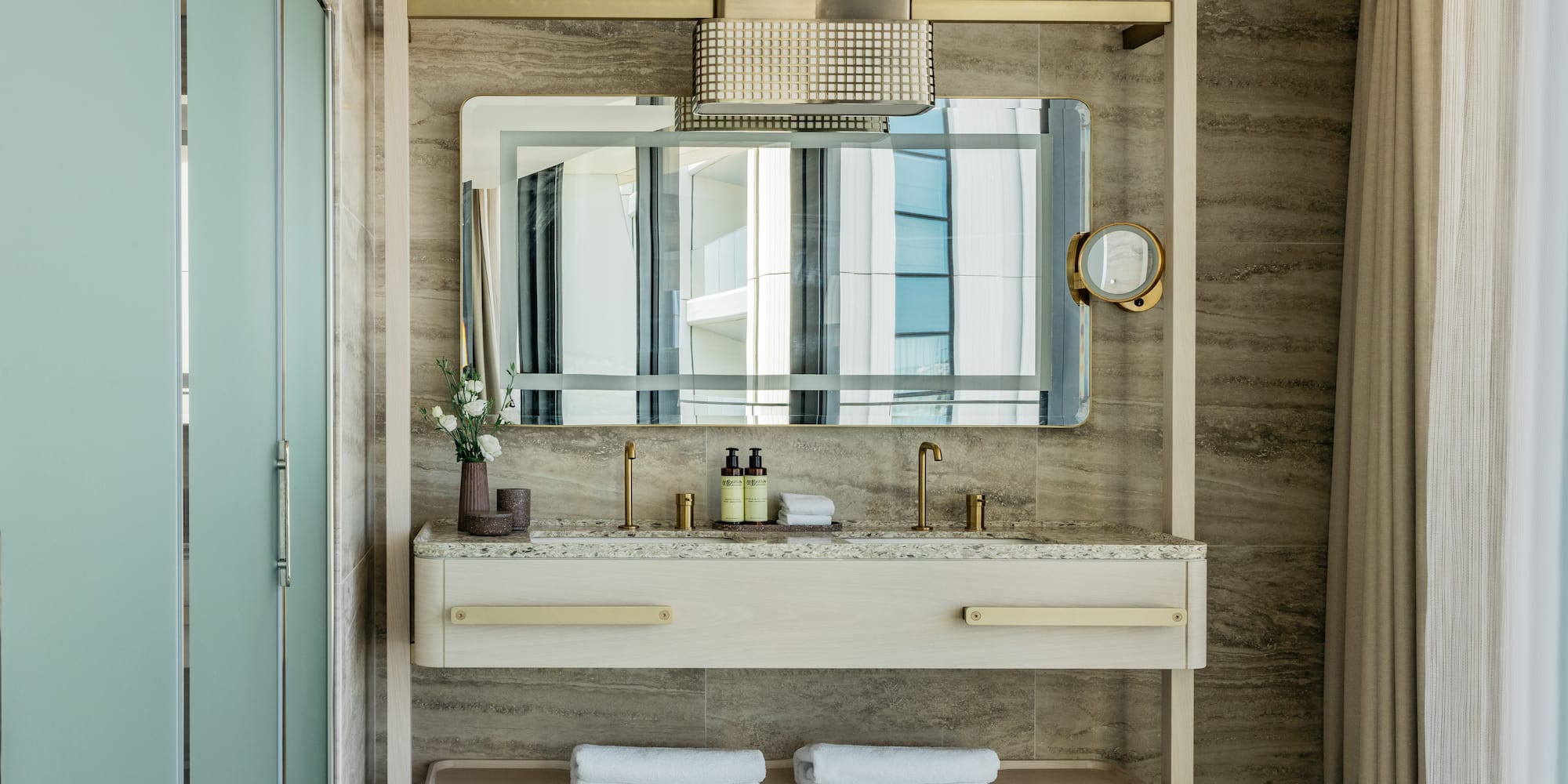 a bathroom with a mirror and sink