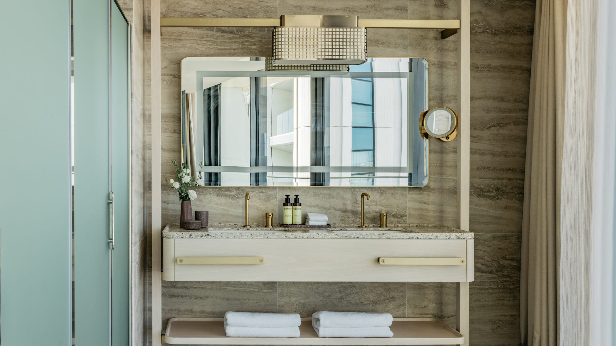 a bathroom with a mirror and sink