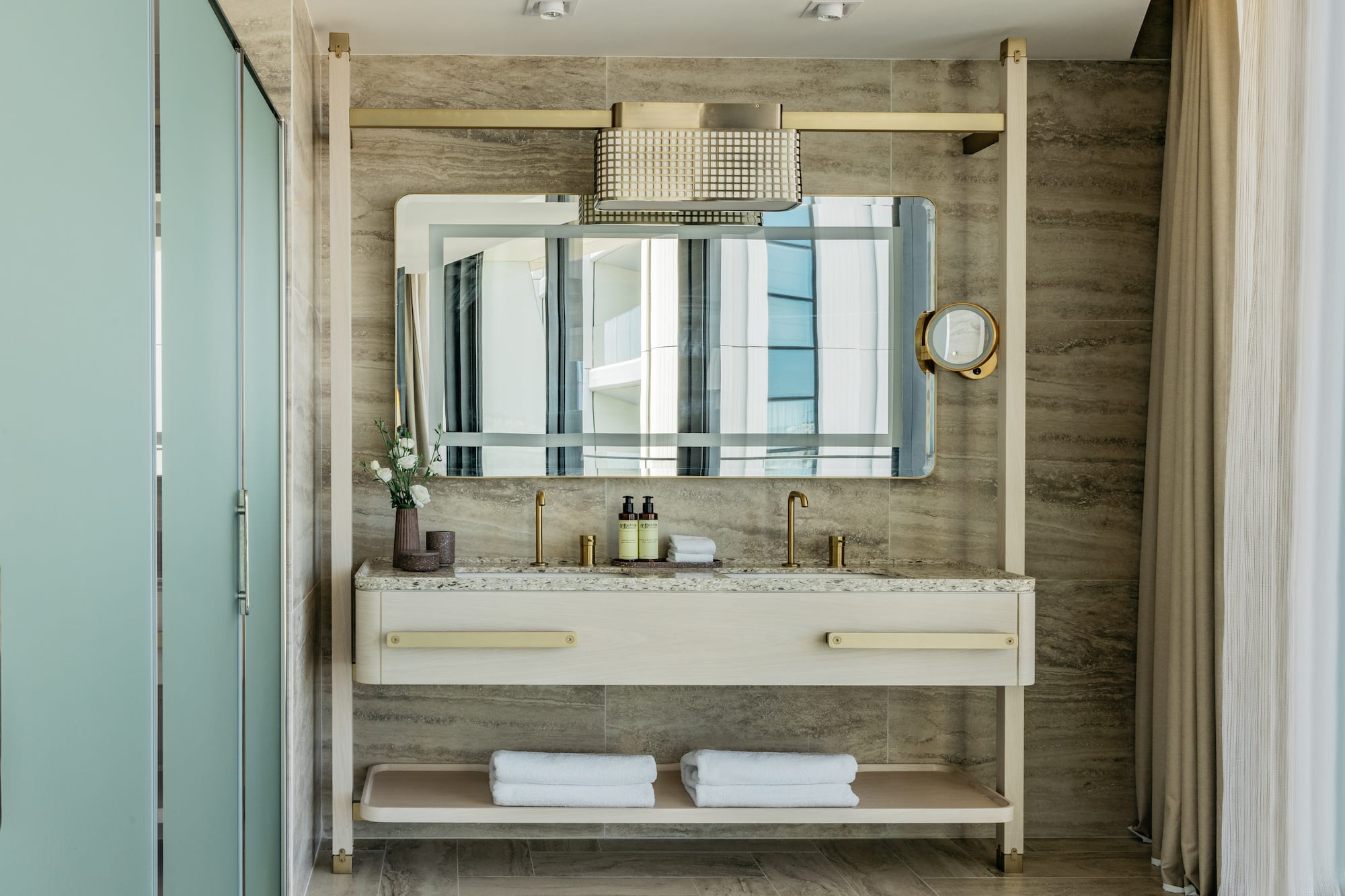 a bathroom with a mirror and sink