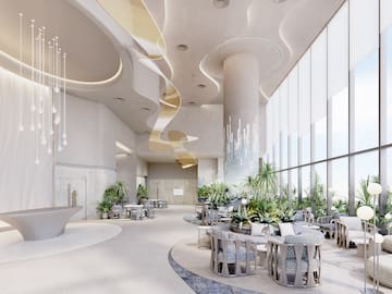 a room with tables and chairs and plants