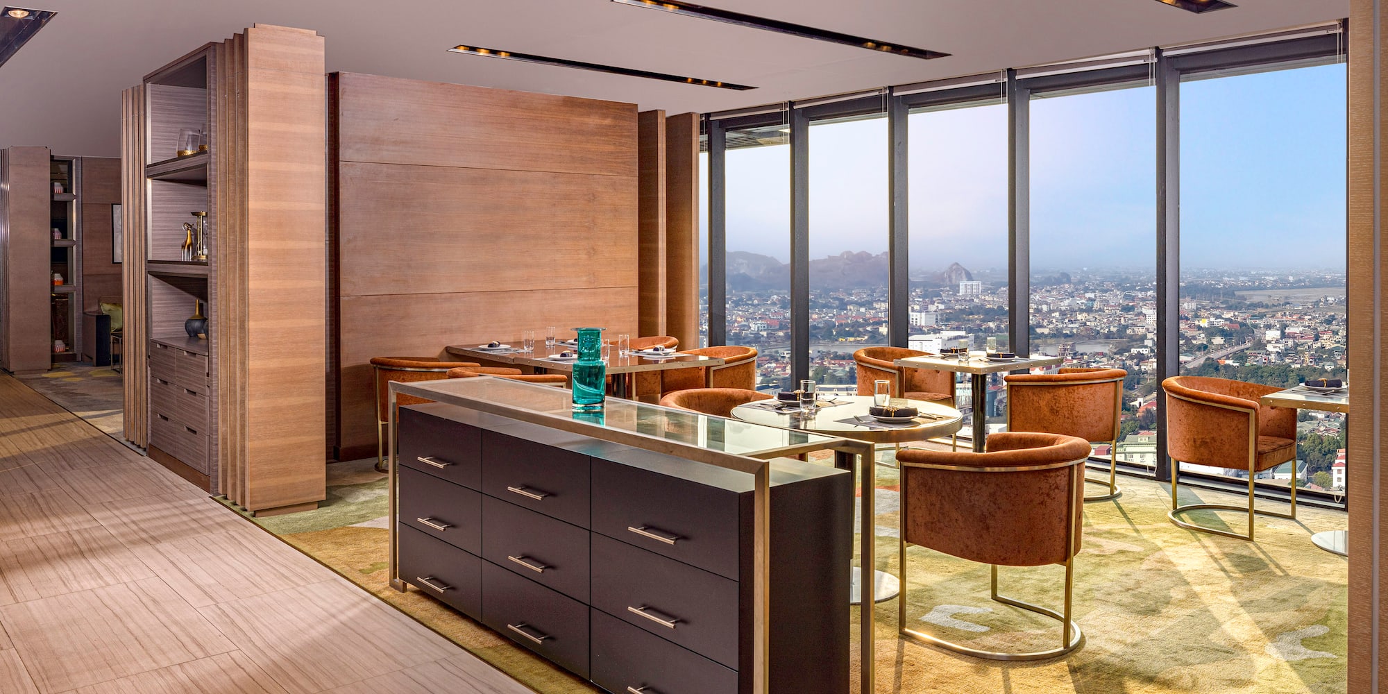 a room with a large window and a city view