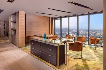a room with a large window and a city view
