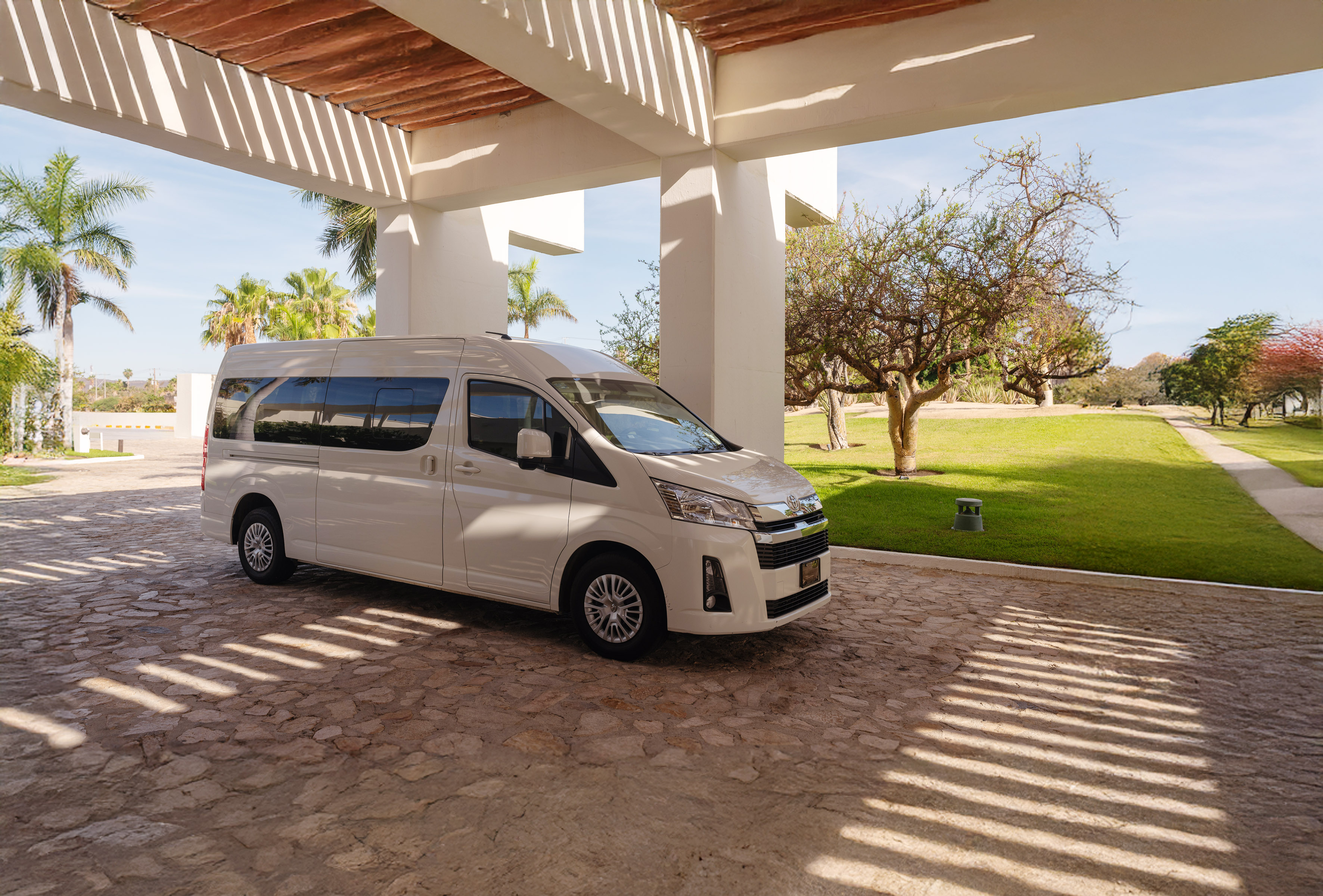 a white van parked under a covered patio