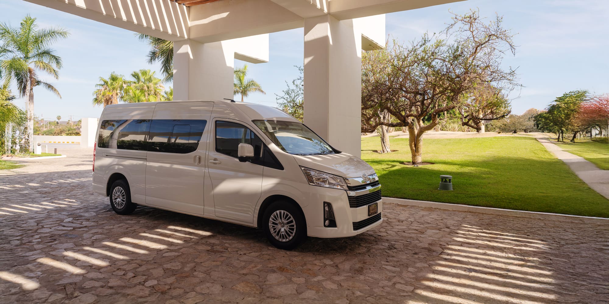 a white van parked under a covered patio