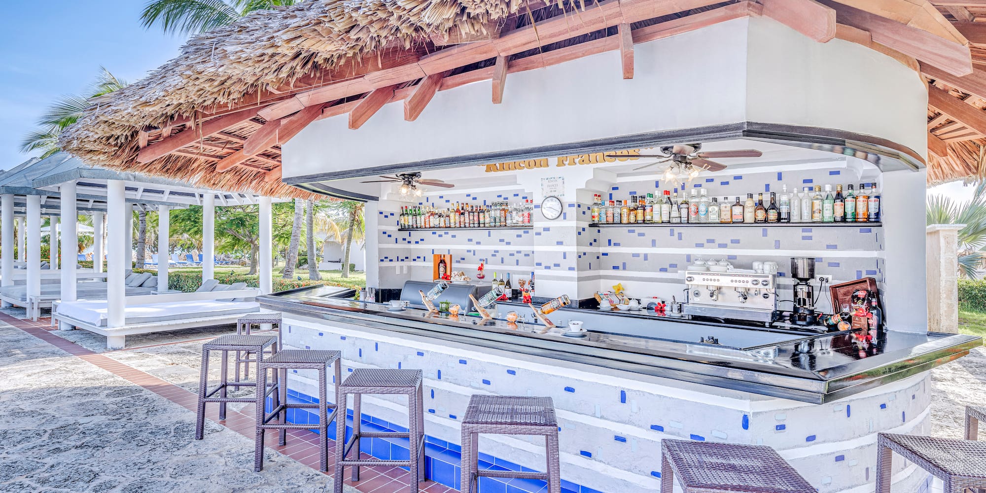 a bar with a bar counter and chairs