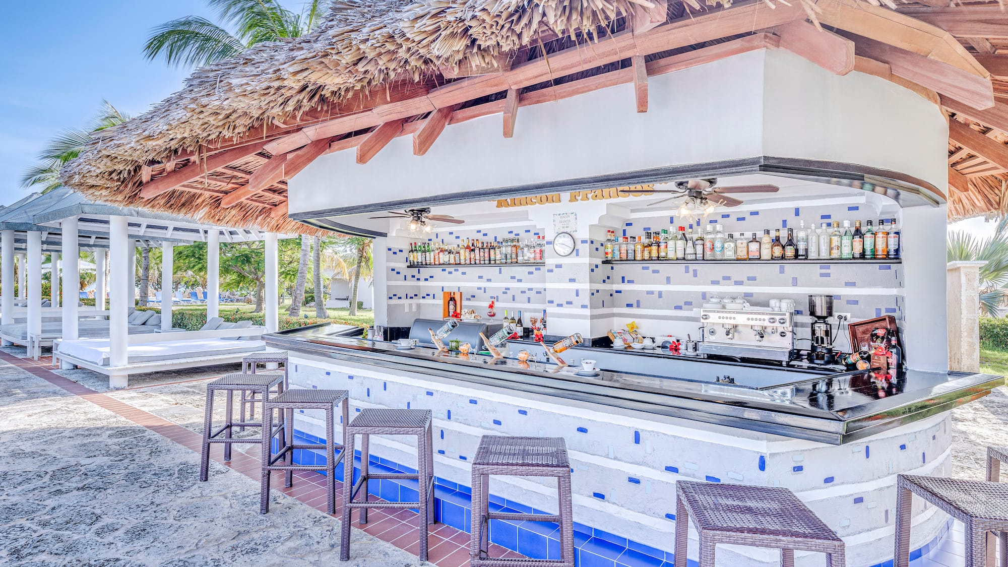 a bar with a bar counter and chairs