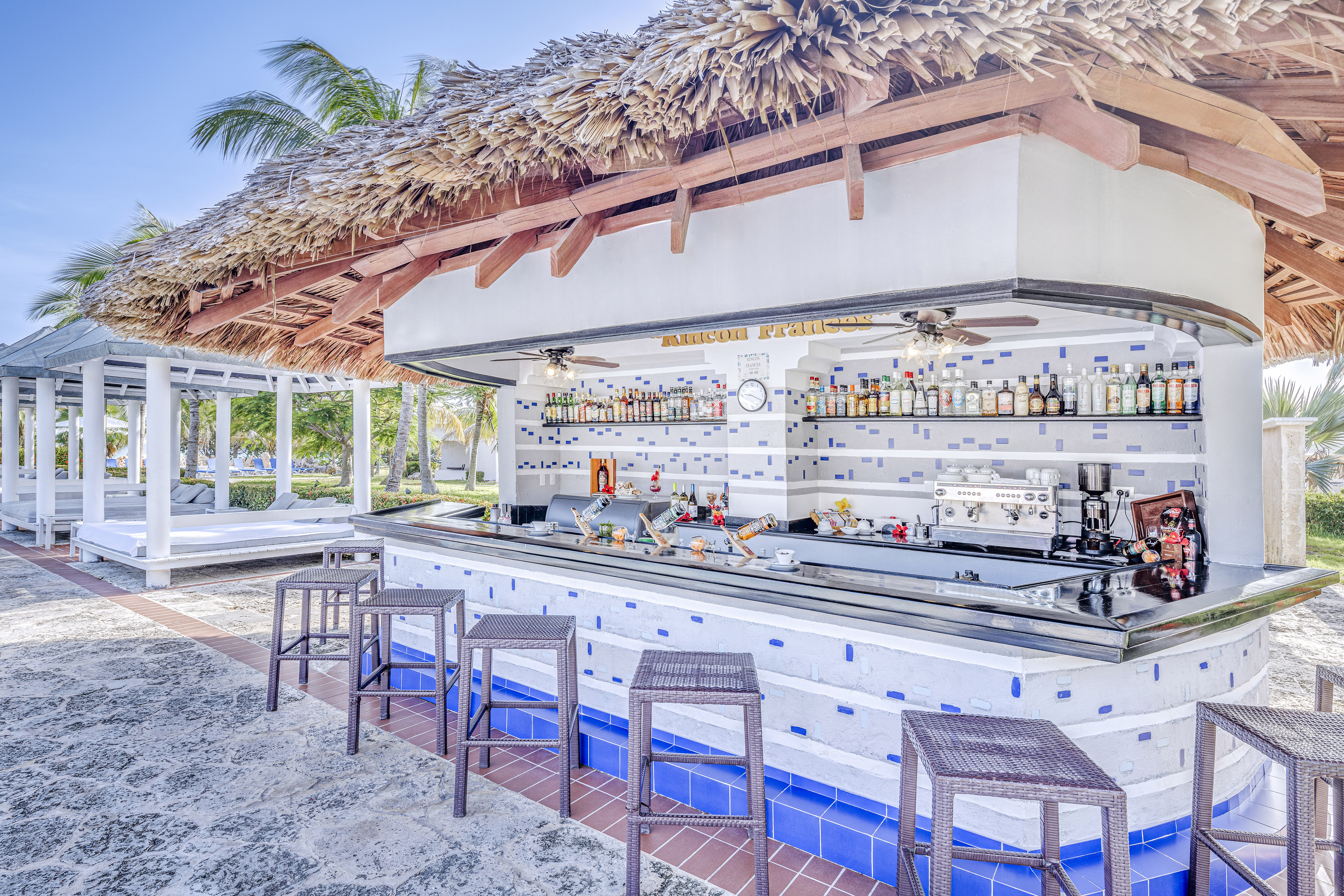 a bar with a bar counter and chairs