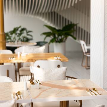a table with gold utensils and a map on it