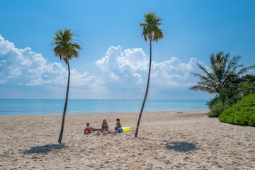 a group of people on a beach