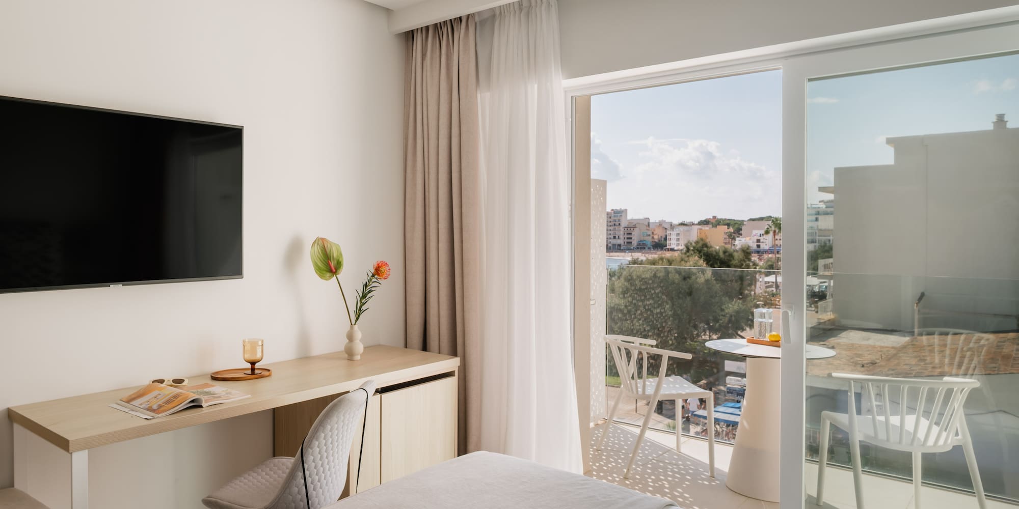 a room with a bed and a television