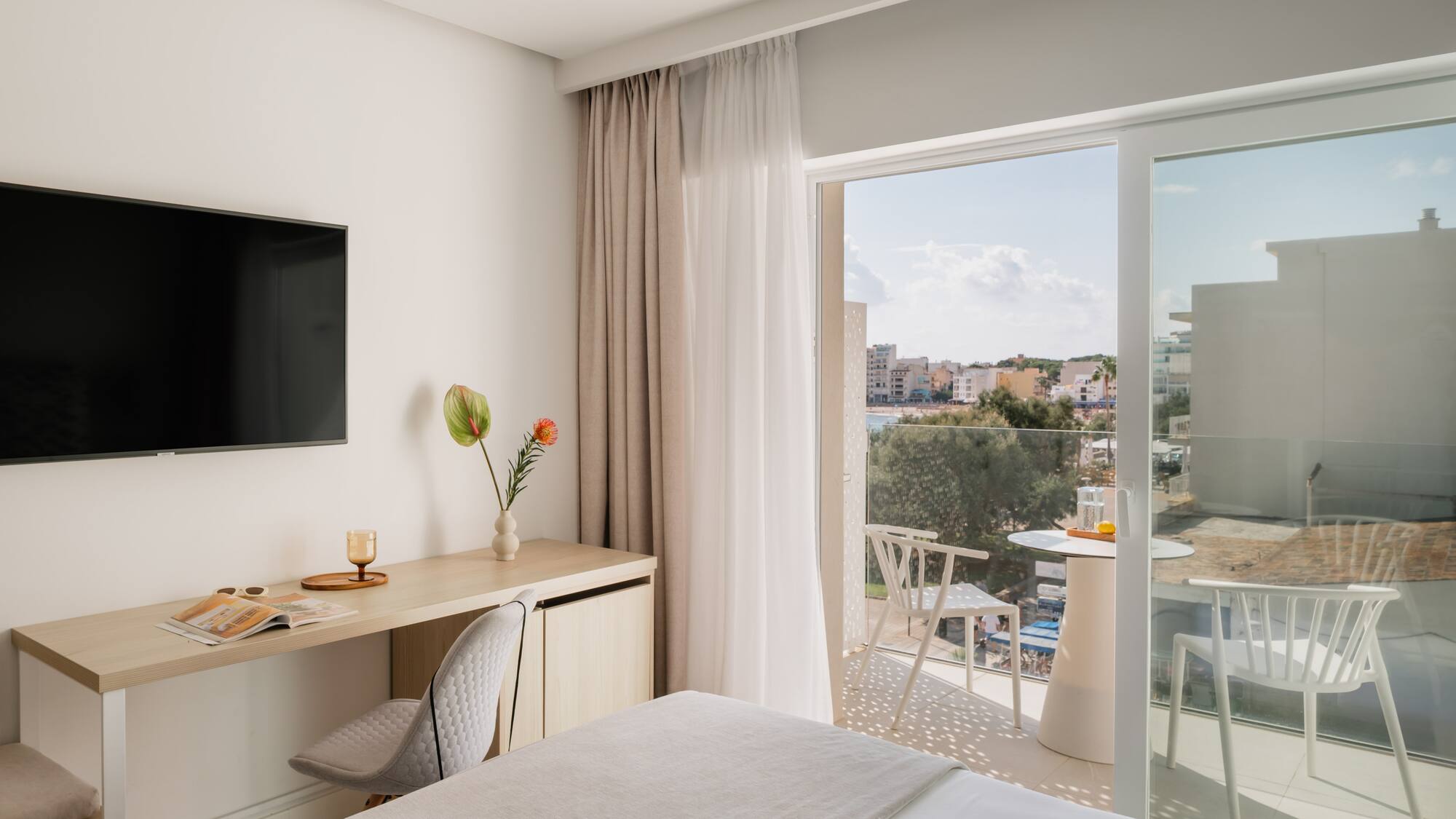 a room with a bed and a television