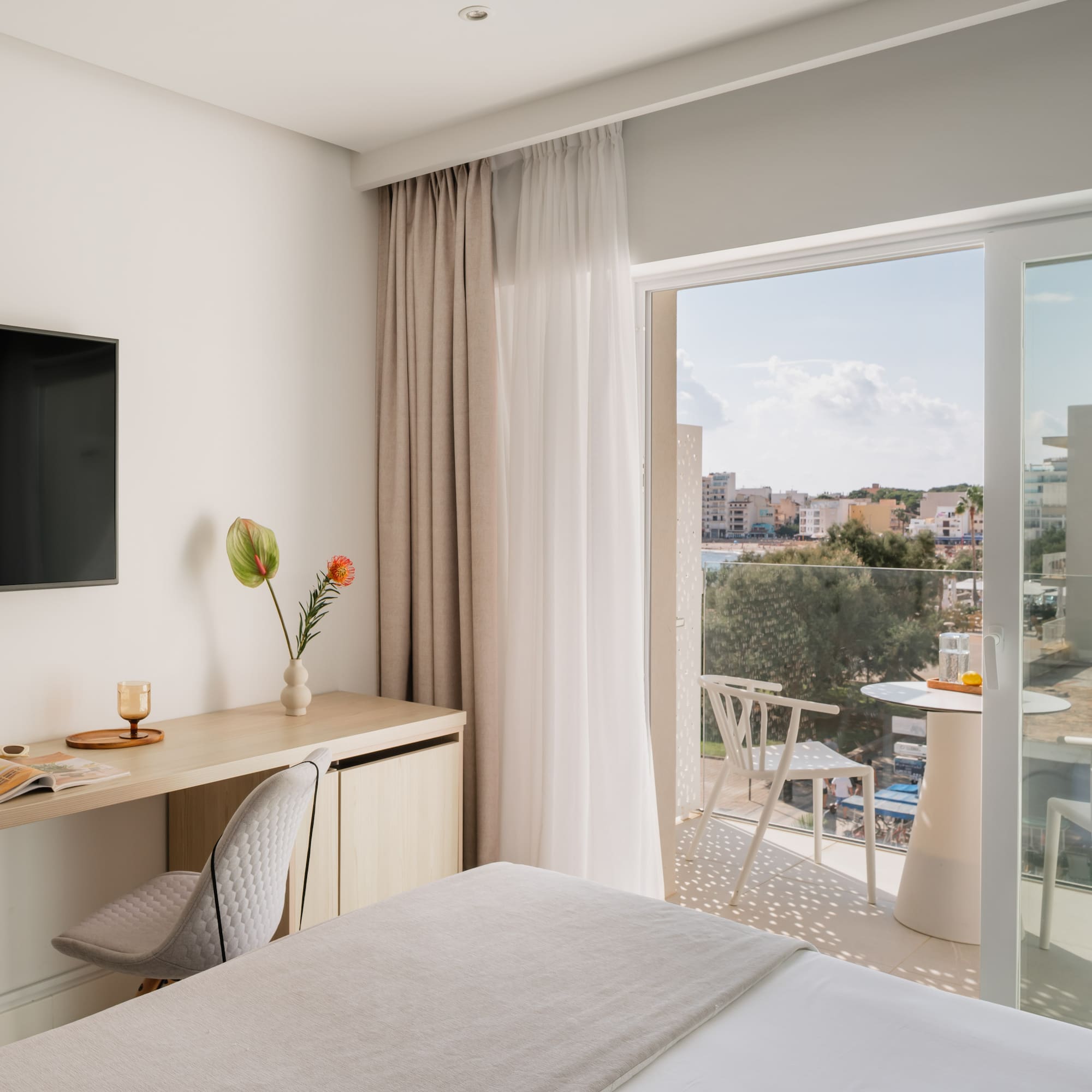 a room with a bed and a television