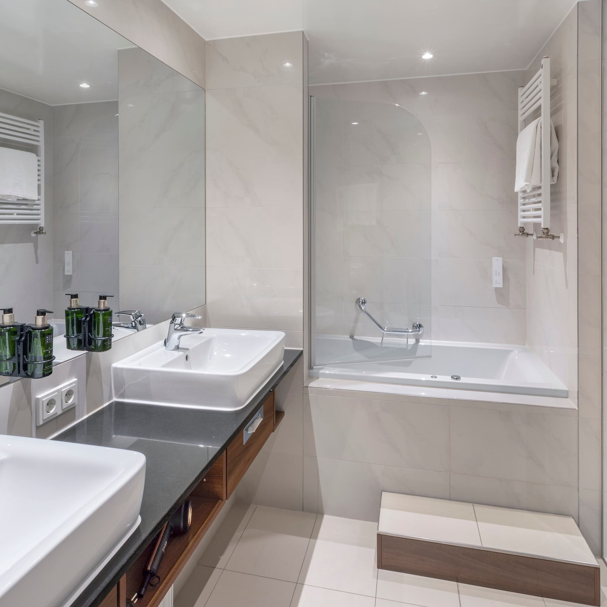 a bathroom with a bathtub and sink