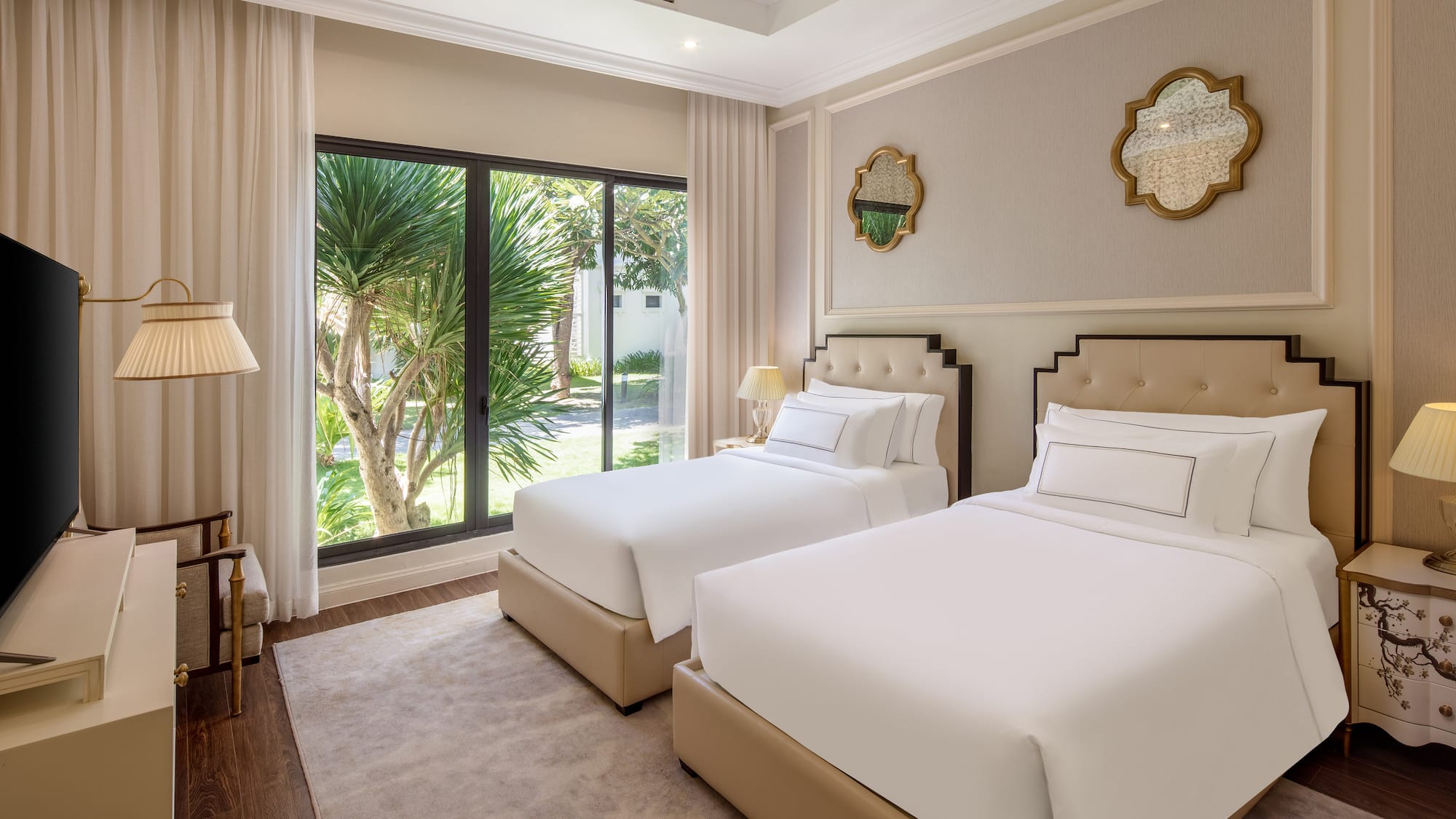 a room with two beds and a glass door