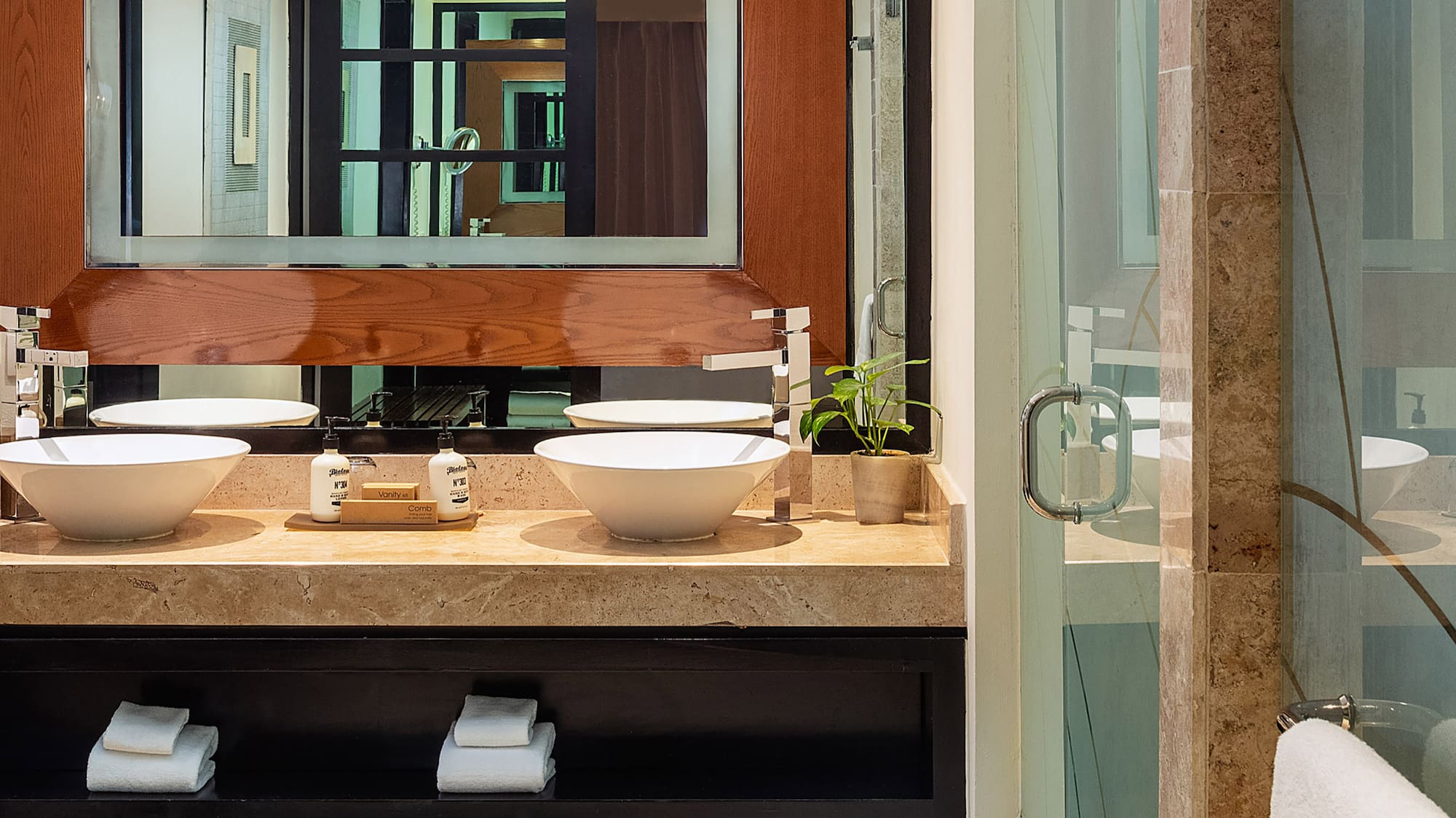 a bathroom with a mirror and sink