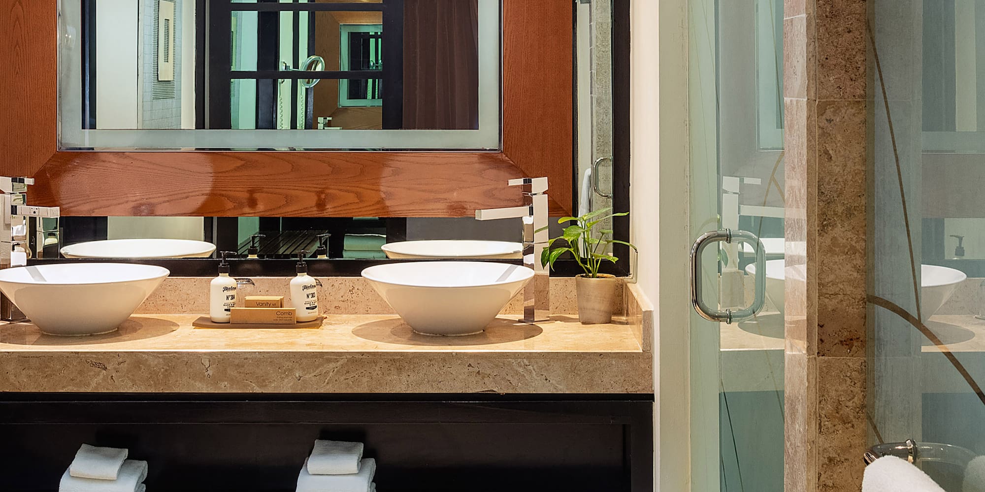a bathroom with a mirror and sink