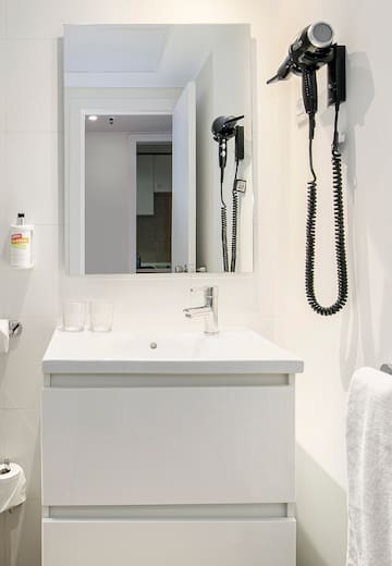 a bathroom with a mirror and a sink