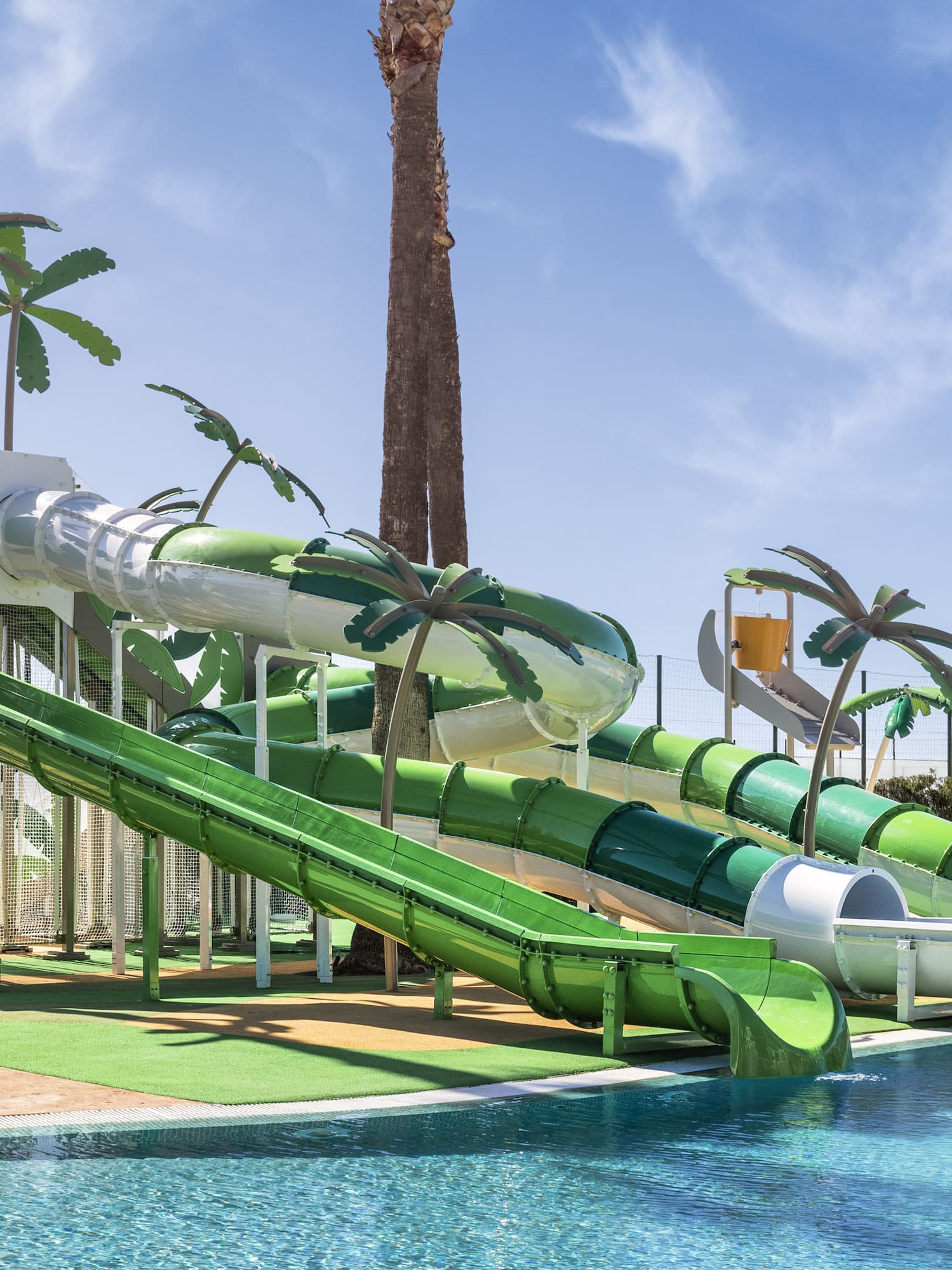 a water park with a pool and slides