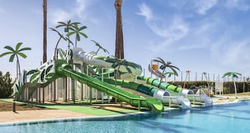 a water park with a pool and slides