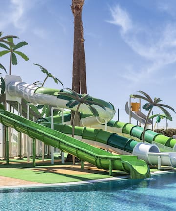 a water park with a pool and slides